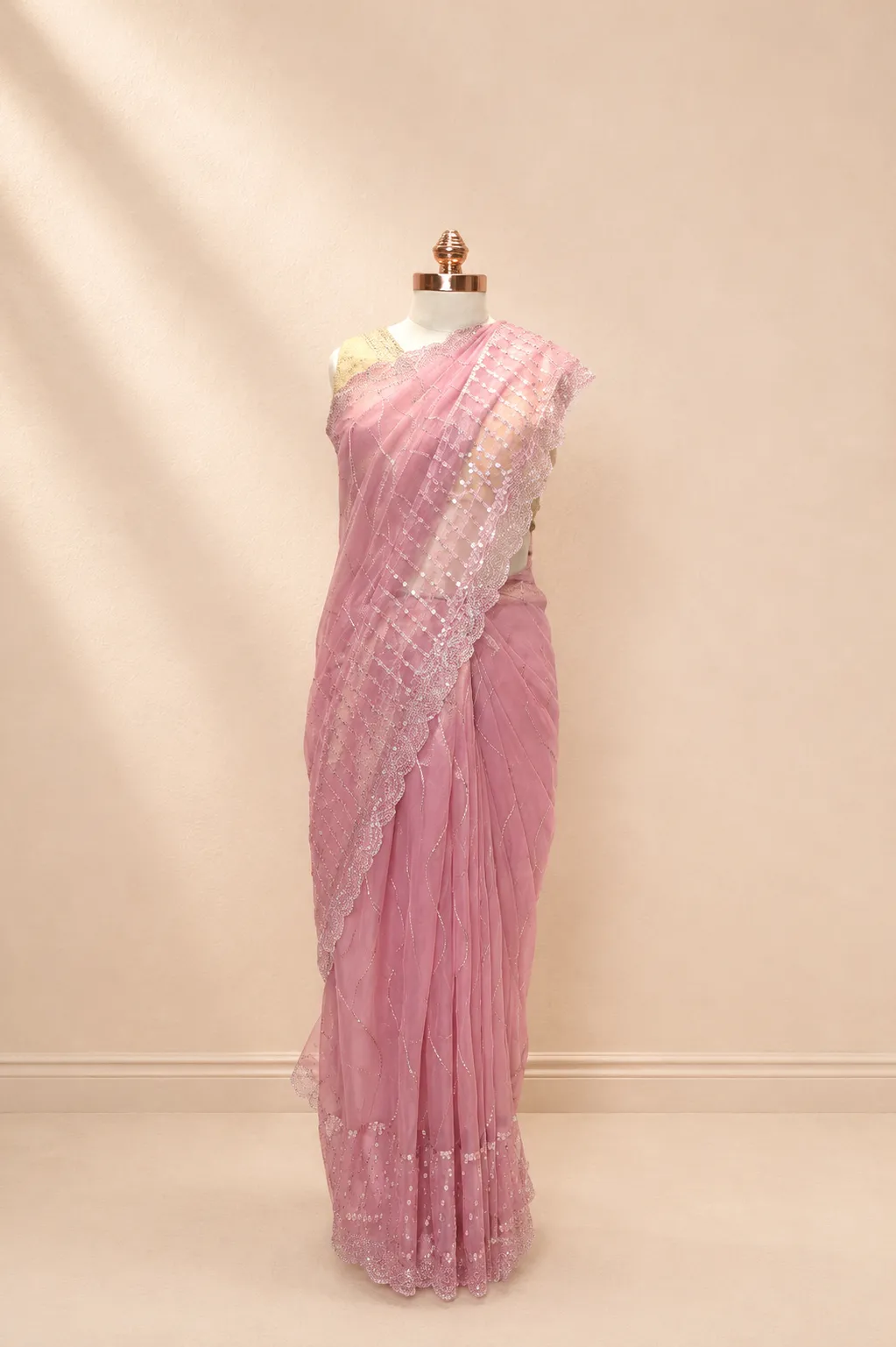 Elegant Onion Pink Net Saree with Shimmering Sequin Wave Embroidery