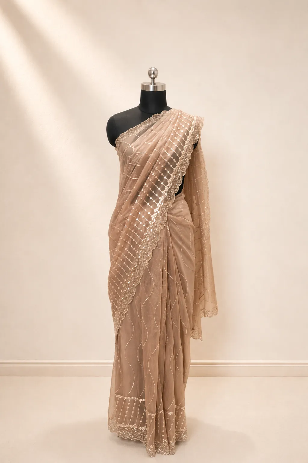 Elegant Ivory Net Saree with Shimmering Sequin Wave Embroidery 